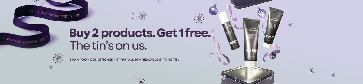 Promotional graphic for a Christmas 'Unwrapped' reusable gifting tin offer, featuring Chirstmas at the top and large text reading 'Buy 2 products. Get 1 free. Full Volume Collection.