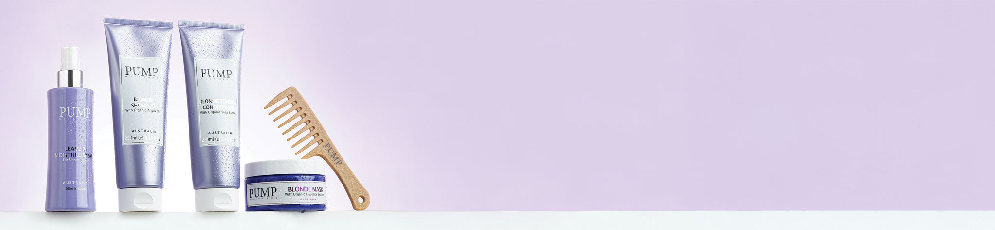 This is a preview of Pump Blonde Range including leave-in moisture spray, shampoo, conditioner, mask wide tooth comb against a purple background