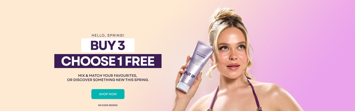 A promotional banner for a Spring Sale, featuring a woman holding a purple 500mL tube of Blonde Perfect Shampoo with text offering a 'BUY 3 CHOOSE 1 FREE' deal against a soft beige-to-pink gradient background.